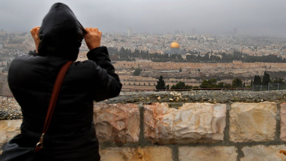 Person looks over at the Old City of Jerusalem on 6 December 2017